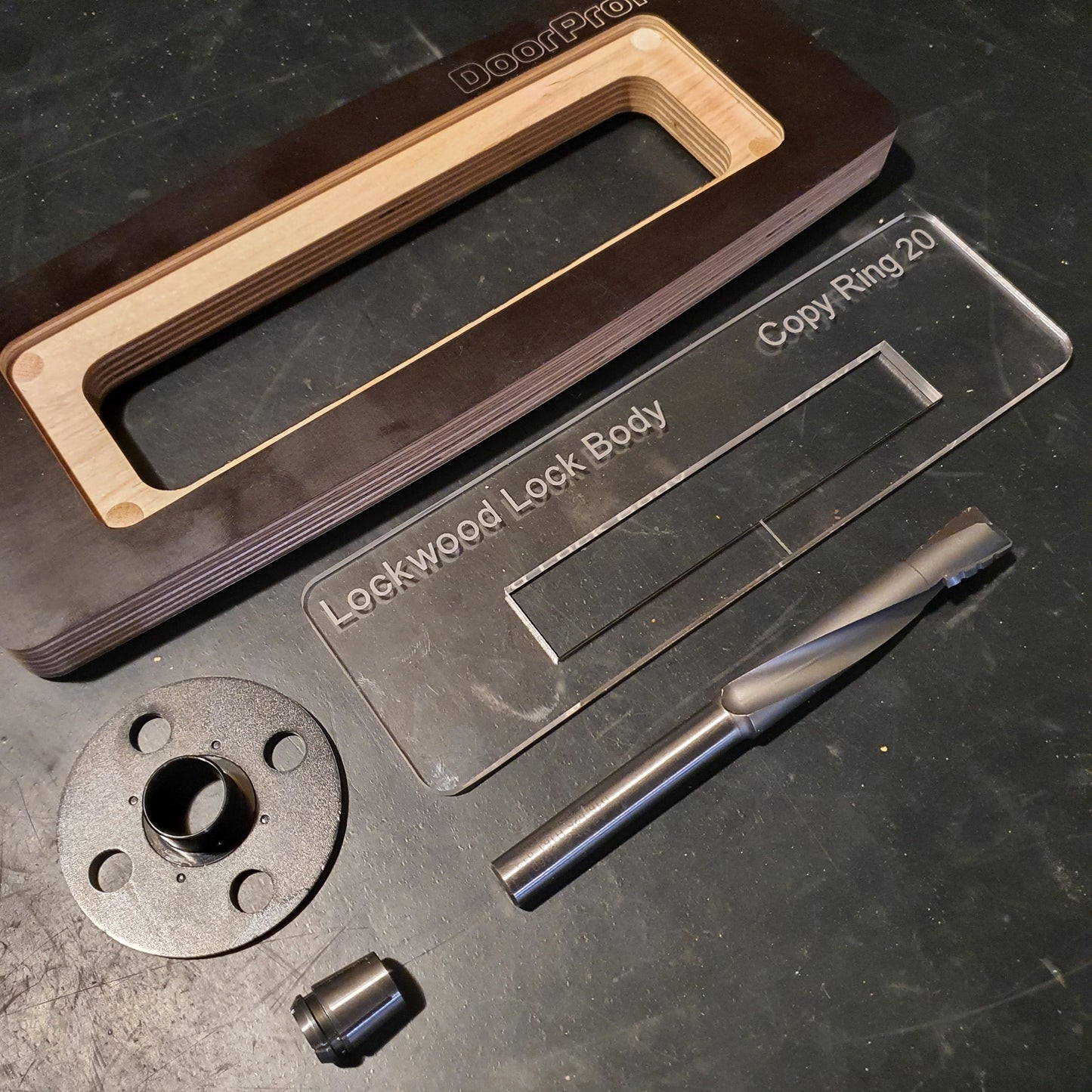 Original Makita 12mm collet cone, shown with other router jig accessories.
